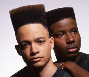 Rap duo Kid and Play. Both rappers sport a high top fade, but Christopher Reid's high top fade is a solid 4 inches taller than Christopher Martin's.