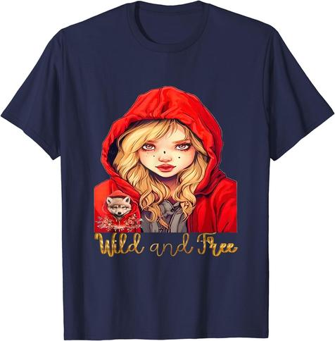 Image of a t-shirt with a design of a girl wearing a red hood with a wolf in her pocket. The text "Wild and Free" is written in bold, white letters above the girl. The background of the image is a t-shirt color