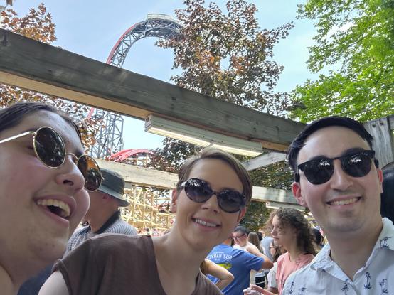 My sister, my wife, and I in the queue for Wildcat's Revenge at Hersheypark. The steel lattice lift hill structure can be seen in the background.
