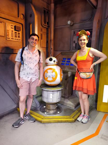 My wife and I posing with BB-8 at Disney's Hollywood Studios