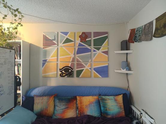 Wide view of Abstract painting made of 12 sections. Color palate is muted earth tones and the background is polygons. Unfinished.