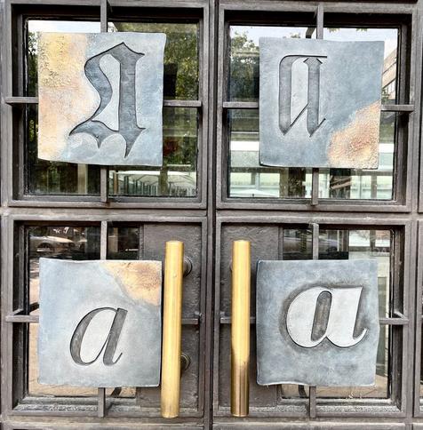 A door made up of A letterforms, details