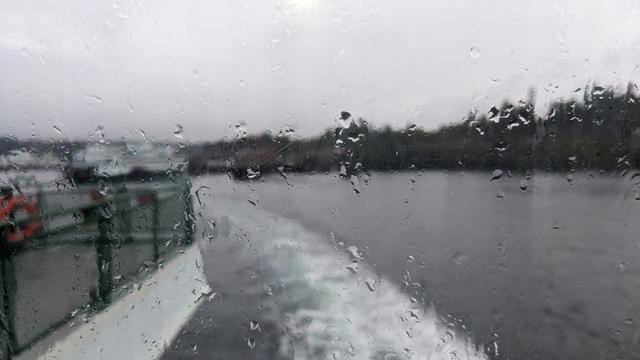 Rain drops on a window of a Washington State Ferry coming out of Eagle Harbor, Bainbridge Island toward Seattle