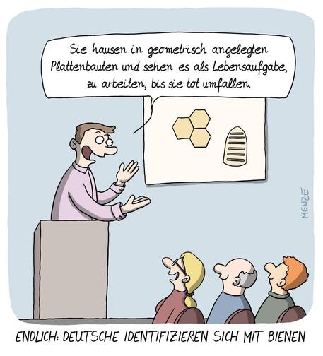 Auf dem Bild ist ein Mann am Rednerpult zu sehen, der auf eine Abbildung mit Waben zeigt und sagt: Sie hausen in geometrischen Plattenbauten und sehen es als ihre Lebensaufgabe, zu arbeiten, bis sie tot umfallen! 
Unterzeile: Endlich - Deutsche identifizieren sich mit Bienen