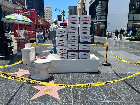 The Hollywood walk of fame star of the former prez has been decorated with a toilet and bathtub loaded with boxes marked "classified." Also, crime scene tape surrounds the area.