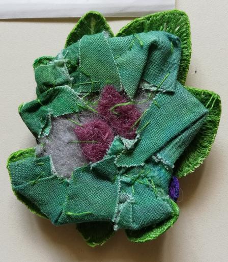 The back of a small clump of stumpwork violets. You can barely see any of the leaves.