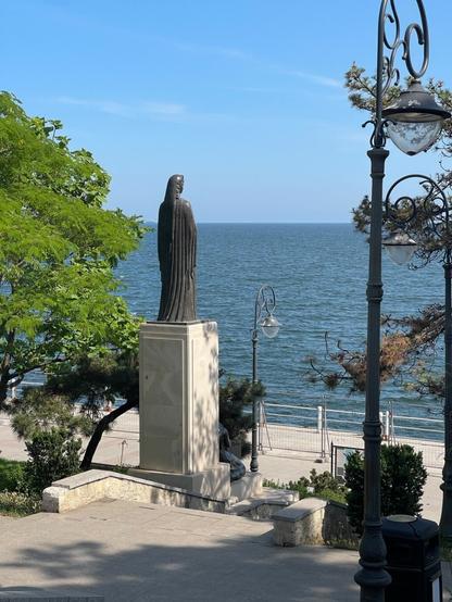 Sculpture of a woman looking out to sea.