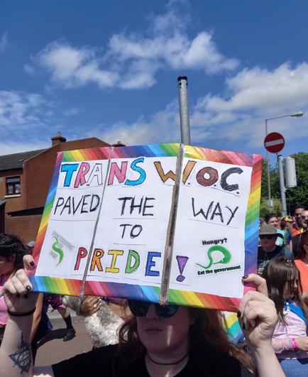 Home-made sign TRANS W.O.C PAVED THE WAY TO PRIDE