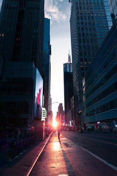 The sunsets directly down a Manhattan street.