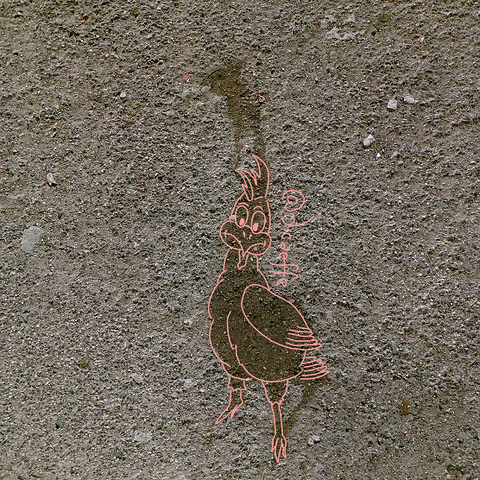 The draw of a chicken over the photo of a Sidewalk