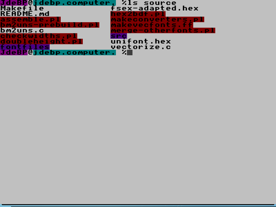 A screen dump of a virtual terminal showing a couple of coloured shell prompts and the output of the ls command, on a white background.  The font is BBC Micro from Unscii.