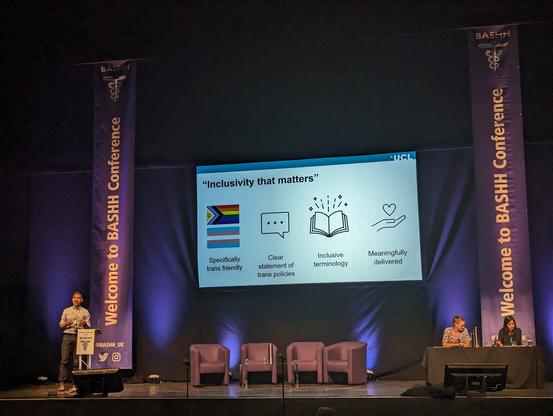Inclusivity that matters slide on stage at the conference.