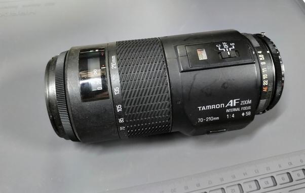 A Tamron autofocus lens on an antistatic mat