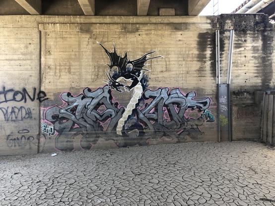 Spray paint art on weir pillar/wall
