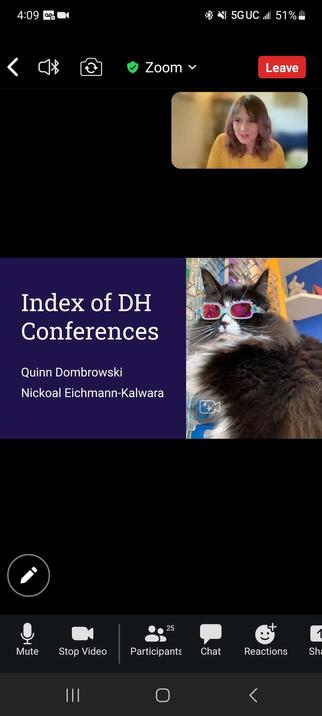Nickoal along with a very cool cat in sunglasses on a slide about the Index of DH Conferences.