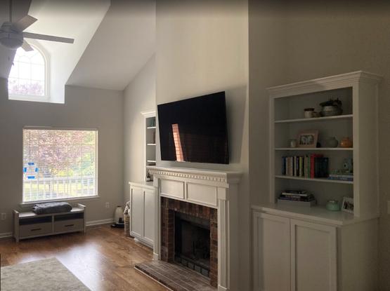TV installation over a fireplace.