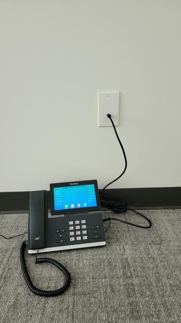 VOIP telephone plugged into Cat.5  outlet we wired and activated.