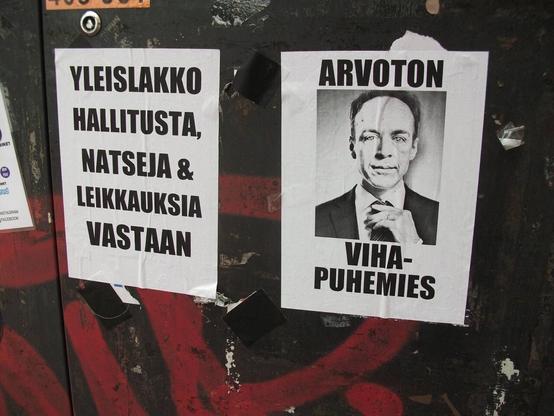kaksi julistetta. 1. yleislakko hallitusta, natseja ja leikkauksia vastaan. 2. arvoton vihapuhemies. halla-ahon kuva.