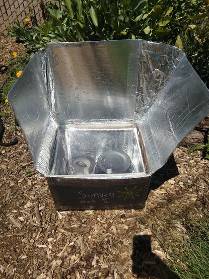 Picture of homemade solar cooker in outdoor setting