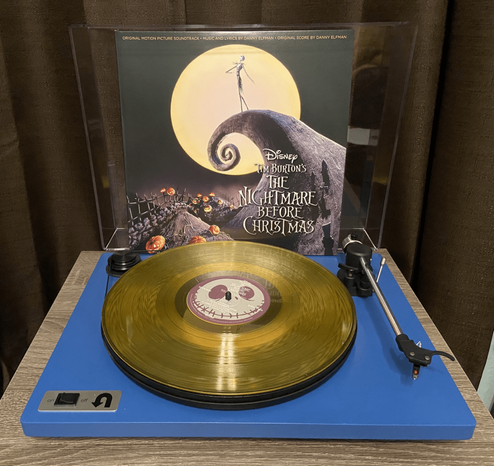 Turntable playing special edition yellow vinyl of Tim Burton’s The Nightmare Before Christmas soundtrack (Disc 2)