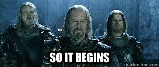 A scene from Lord of the Rings: The Two Towers - at the battle of Helms Deep.  The king, flanked by two of his men, stands grimly in the pouring rain.  (He is looking out at the oncoming army about to attack them.)

White text reads, SO IT BEGINS