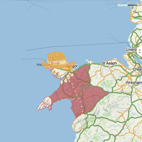 The draw of a person pointing to Wexford on the map of Anglesey island and Llŷn peninsula (UK) from OpenStreetMap