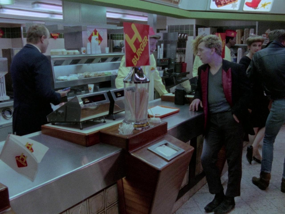 F.M. Einheit placing an order at H Burger. The 80s were hell, don't believe the hype.
