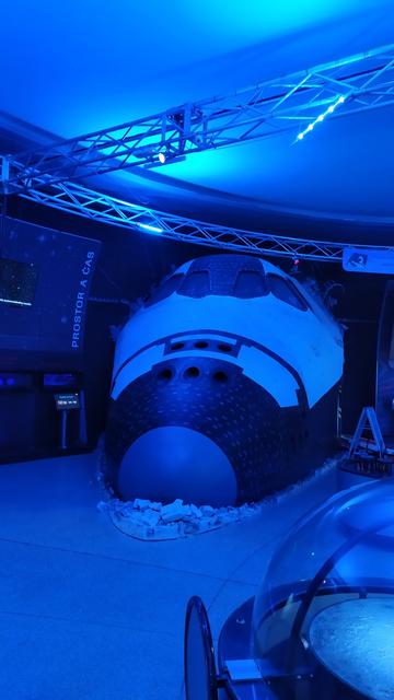 A model of a cockpit of a Space Shuttle under blue illumination in the Foyer of the Planetum.
