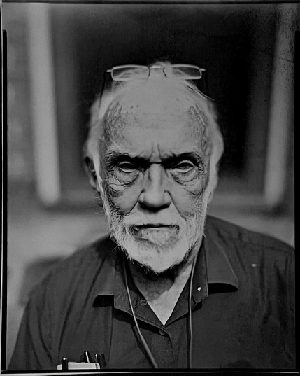 A very contrasty paper negative portrait of my dad sitting on his front steps. Looking very serious as he usually does.