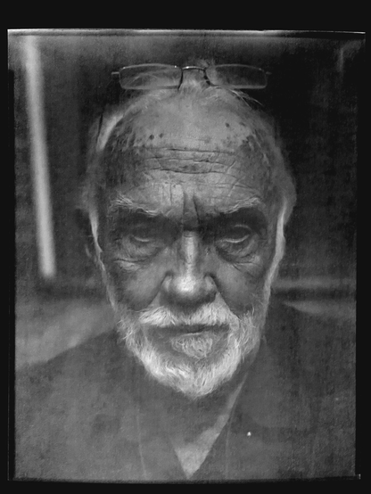 Another closeup portrait of my dad, this time even closer. This is a smaller aperture shot, so more is in focus,  but it’s also even muddier because I underexposed it by at least a stop and had to try to bring it out when inverting it in light room.
