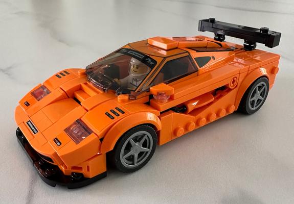 A Lego model of the McLaren F1 LM road car. Bright orange.