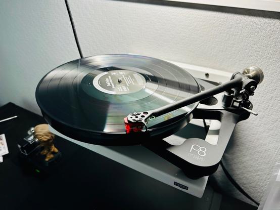 Photo of a record spinning on a turntable.