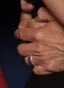 An extreme close-up of Con's hands wrapped around my waist