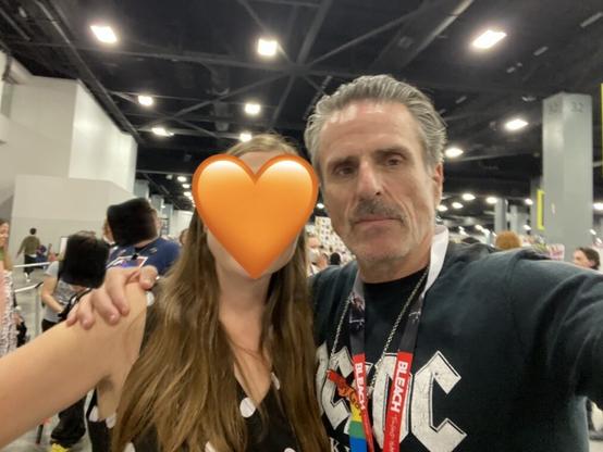 A selfie of two people facing the camera - me with an emoji over my face and Con O'Neill