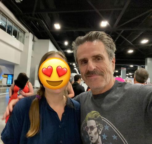 A selfie of two people facing the camera - me with an emoji over my face and Con O'Neill