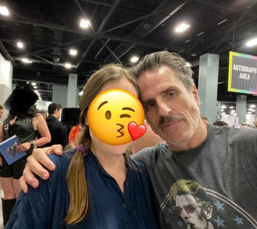 A selfie of two people facing the camera - me with an emoji over my face and Con O'Neill