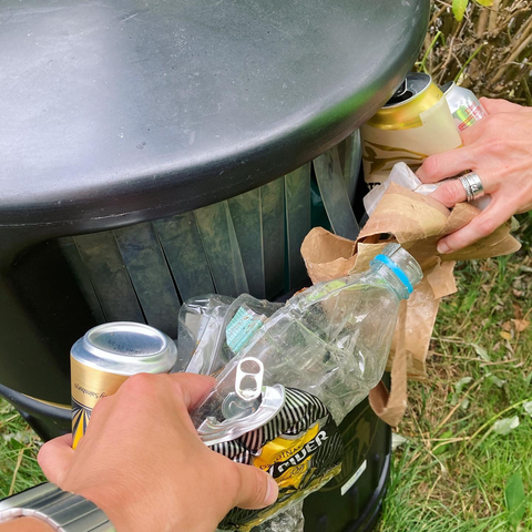Putting rubbish in a bin
