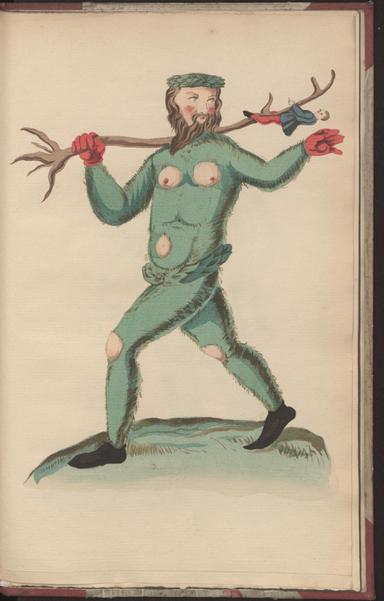 A bearded figure wearing a green, tight outfit that displays his pecs and nipples, navel, and knees. He has black shoes and red gloves and is carrying a stick with a little doll child hanging from it.
