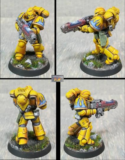 Hellblaster Space Marine. Bright yellow armour with blue flame details.