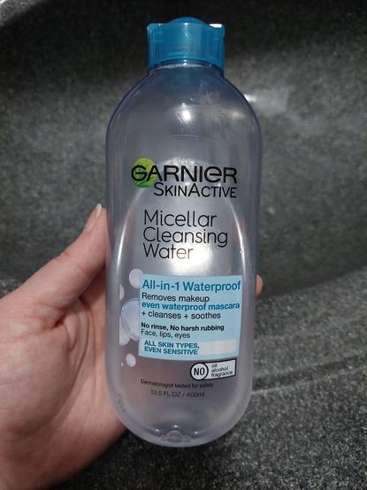 Bottle of Garnier SkinActive micellar cleansing water, the all in 1 waterproof version with the blue lid. Says it's for all skin types, no oil, alcohol, or fragrance, good for whole face including lips and eyes