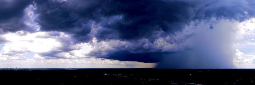 Blue dramatic sky panorama of weather front moving in on Kirkwood MO