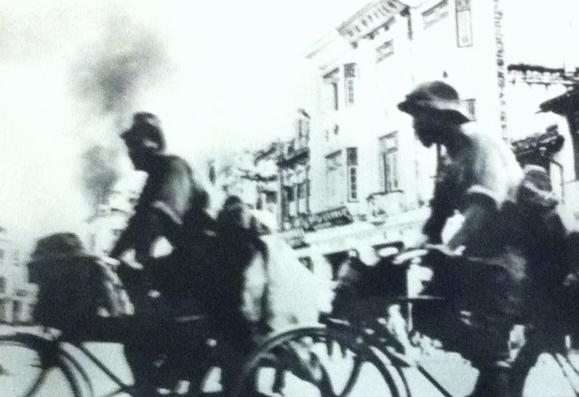 Japanese soldiers on bicycles during the invasion of Singapore