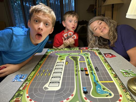 People playing Downforce boardgame.