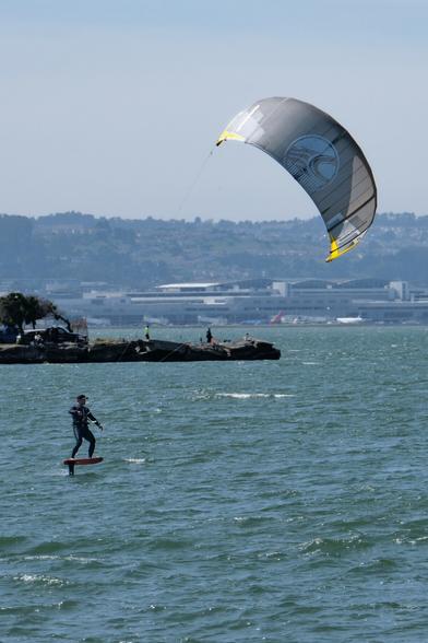 A windsurfer riding the Bay.