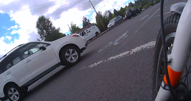 driver turning a too-wide left into the bike and bus lane rather than the first (as per traffic law) or even the second car lane, because they want to be in the right lane for Bertha Blvd, and probably used to assholes who try to pass them in the turn
