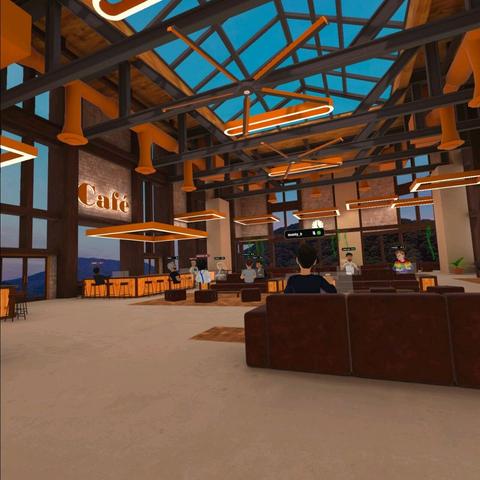 Several other avatars working diligently on their computers inside  a virtual cafe