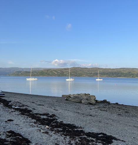 Three yachts on the Kyles of Bute on a perfect summer evening