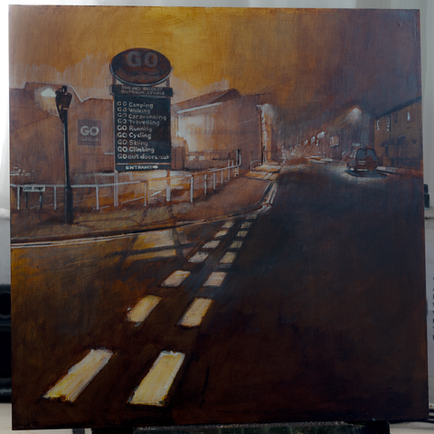 Looking down a misty, street lamp lit, Hill Street, here in Sheffield, with the sign of the 'Go Outside' camping store being the main focus. An eerie amber/umber glow, sourced from Bramall Lane football stadium, fills the cloudy night sky and a foggy haze threads through the empty street. The reference image was taken in late December 2021 when considerations for yet another lockdown were in the forefront of people's minds but never happened. There's an ironic tension with the sign "GO Camping, Go Walking, Go Caravanning .... " that sits with the ominous foreboding feel of the scene and the claustrophobic feel of the time. No lockdowns at this point happened, but there were still restrictions in place for office workers to work from home, and other measures continued.