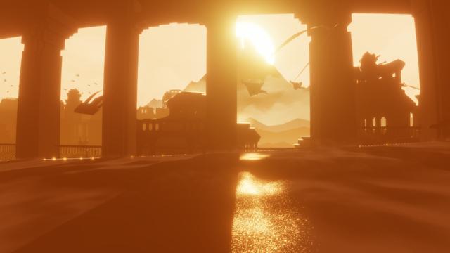 Screenshot from the game Journey with two players silhouetted against a sunset as they sand surf across the screen