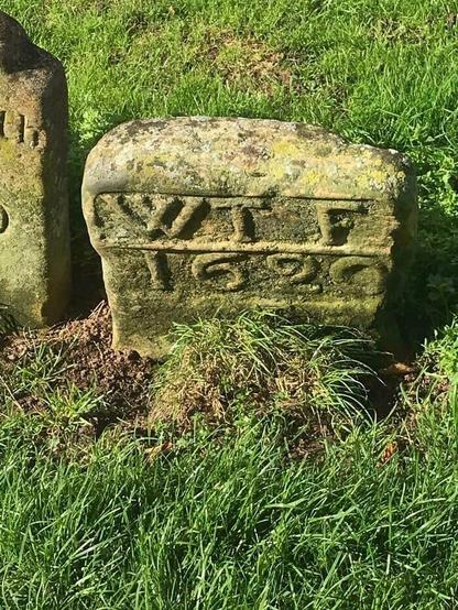 Small, weathered gravestone, with this inscription:

WT F
1620